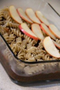 adding a layer of thinly sliced apples