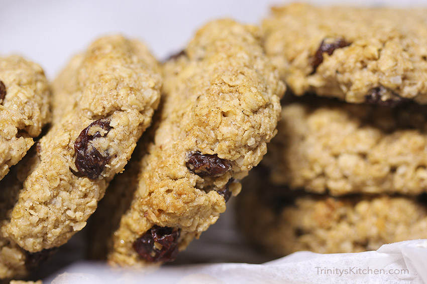 Spicy nutmed cookies, made with gluten-free oats, cinnamon & raisins. Vegan recipe from Trinity Bourne