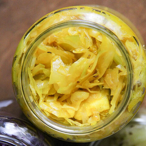 Homemade sauerkraut in a jar 3 different wasy with white cabbage, turmeric and ginger