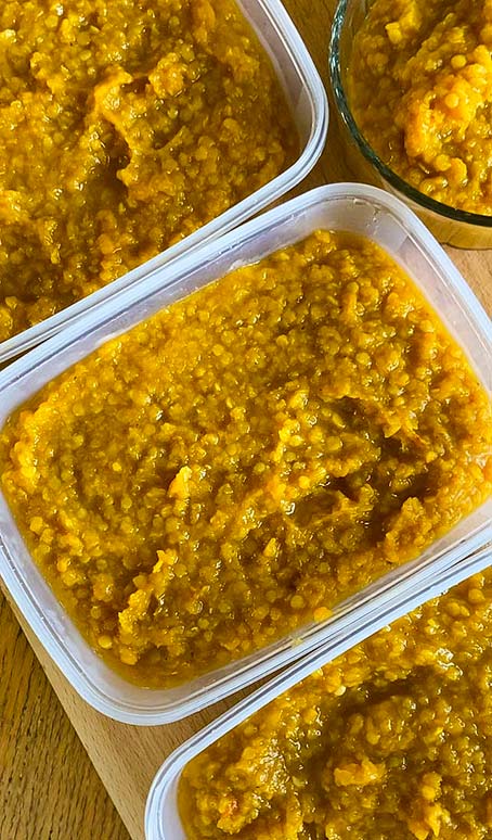 Red lentil butternut dhal in containers for freezing and batch making