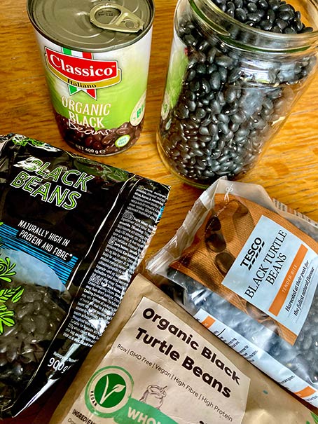 black beans and black turtle beans in different packets