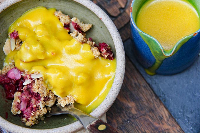 Fruit crumble with homemade vegan turmeric custard
