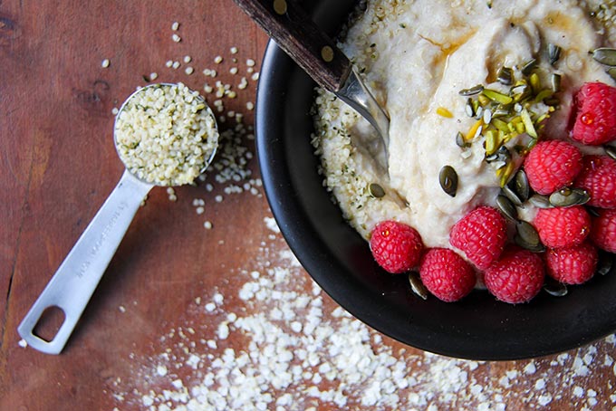 Gluten-free vegan quinoa flake porridge recipe with hemp seed and dates