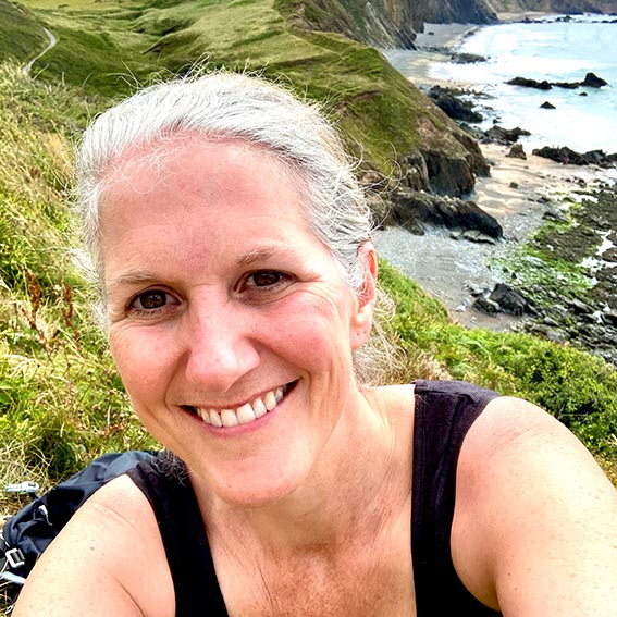 Ana in the sun on coast path in wales