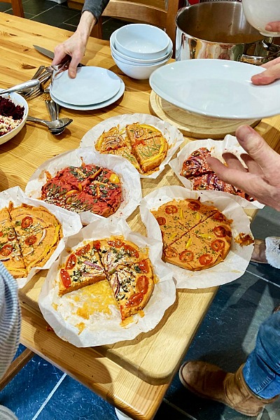 Guests make oil-free baked farinata slices on retreat with Anastasia