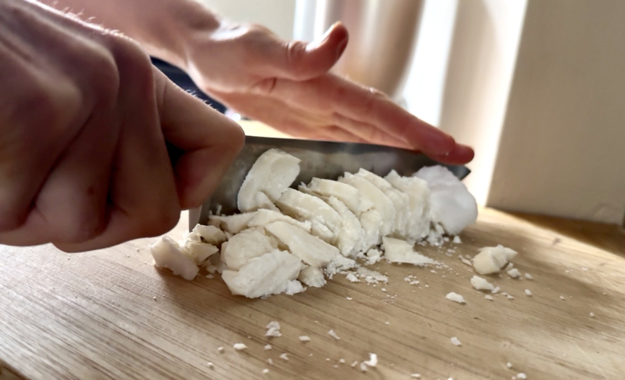 Chopping creamed coconut block
