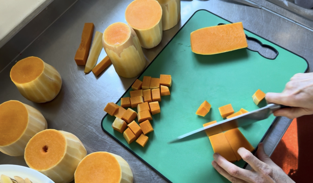 Dicing butternut squash for roast squash curry on retreat